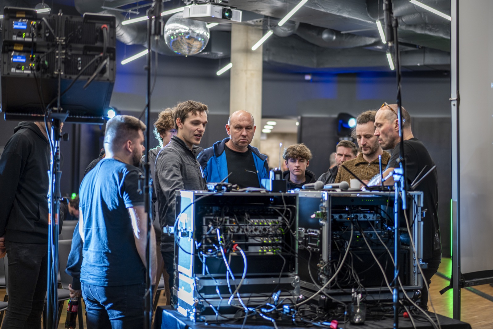 Visitors watching an audio equipment demonstration