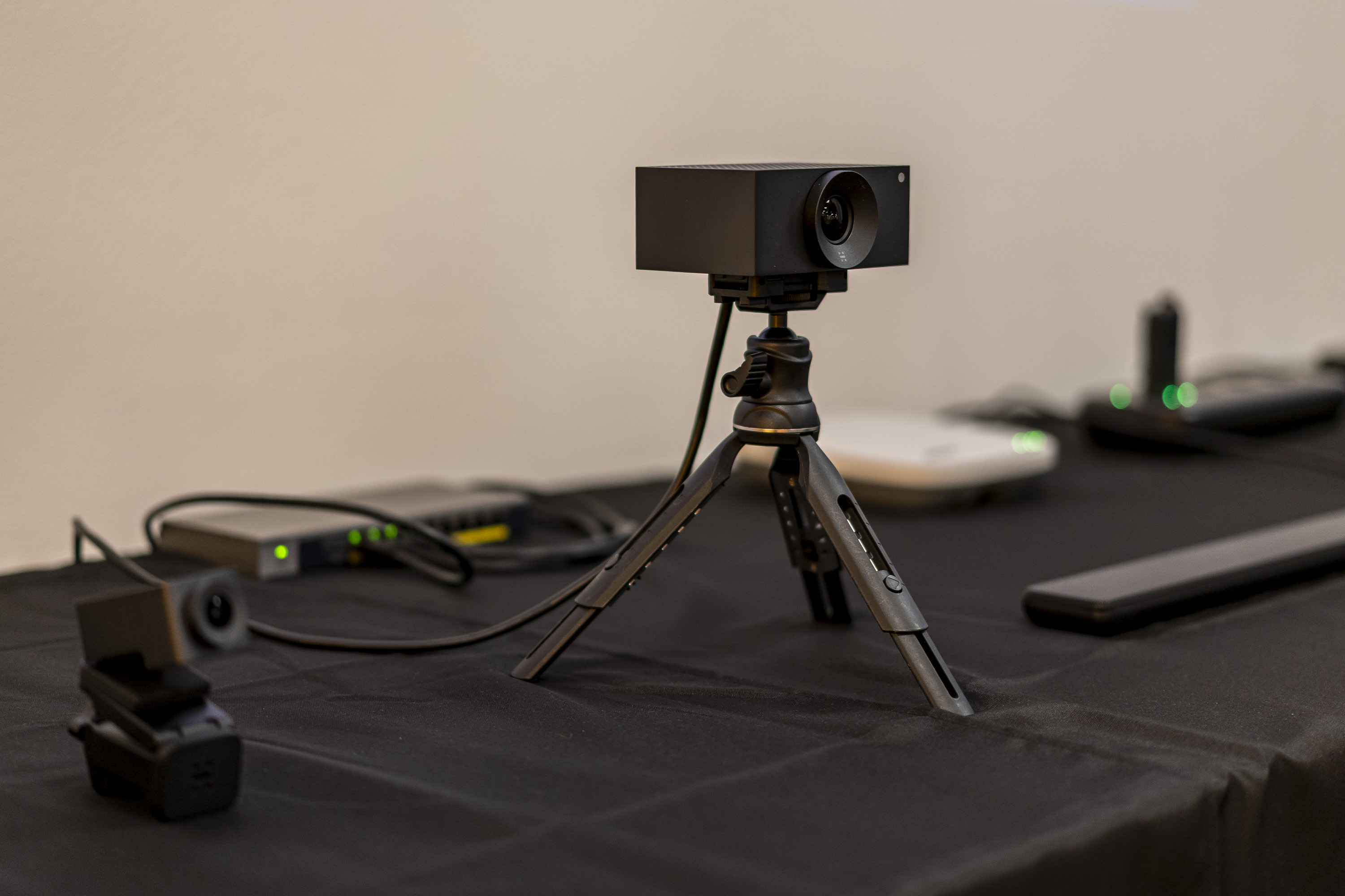 Close-up of a conference camera on a tripod at a product presentation